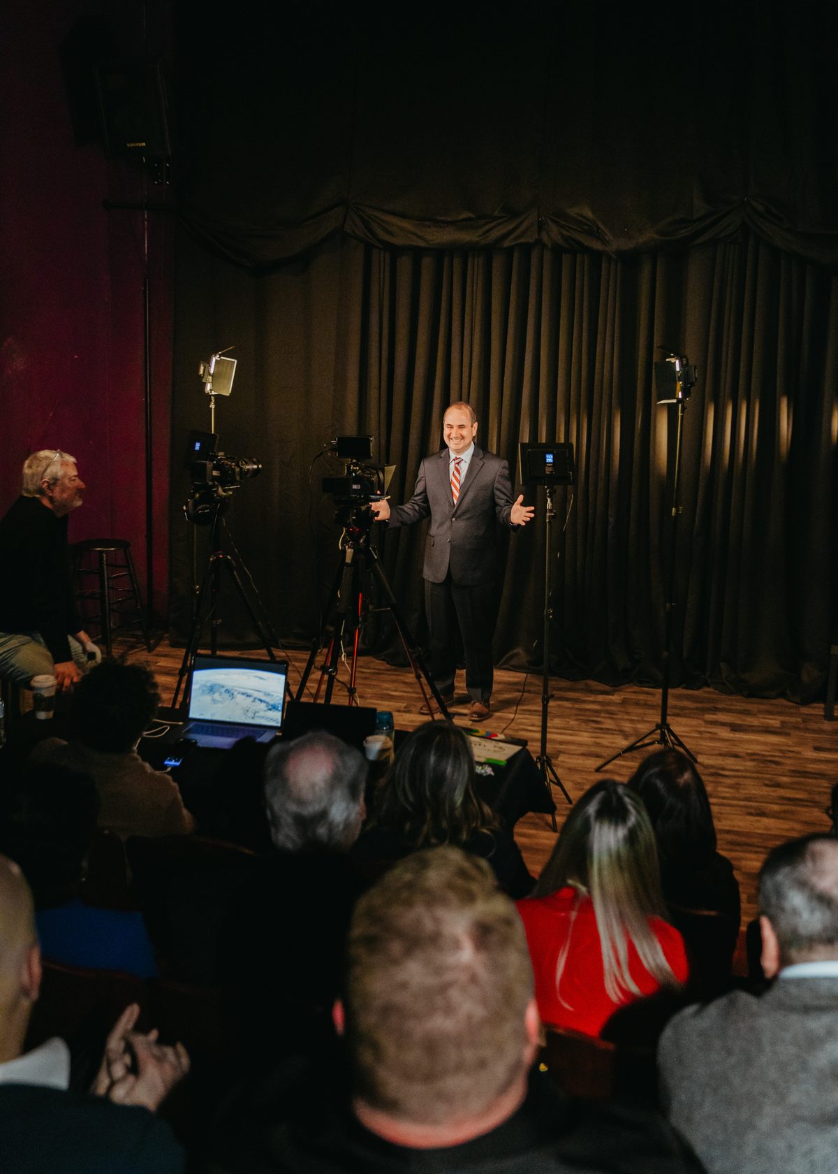 Rene M. Miller speaking on stage